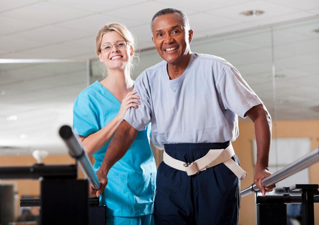 Nurse helping patient to do recovery exercises